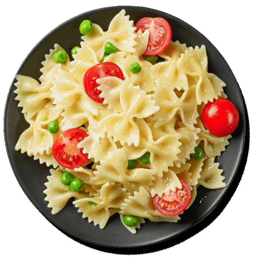 Bowtie pasta noodles with tomatoes and peas in a bowl