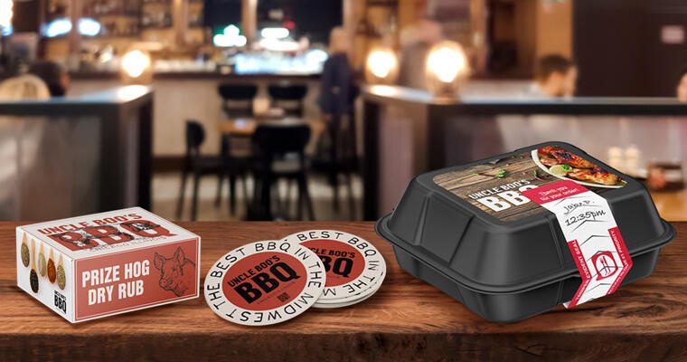 A selection of branded takeout packaging and drink coasters