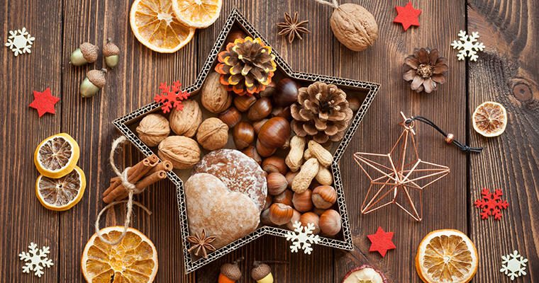 A star-shaped holiday gift box holds baked goods and nuts