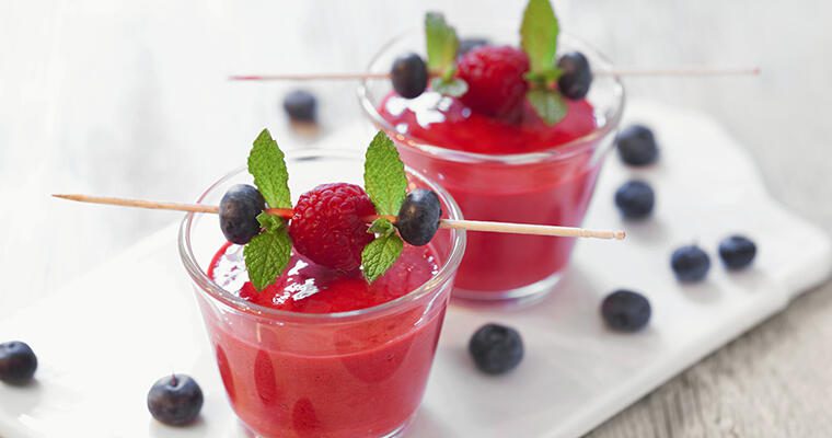 Festive beverages with skewers of blueberries