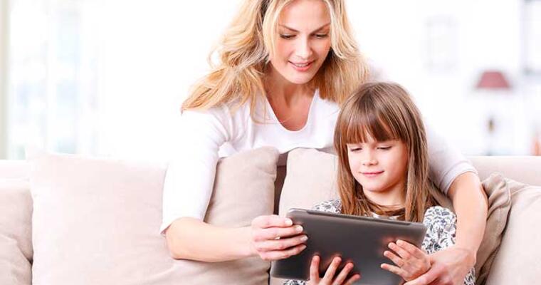 Mom and daughter looking at iPad