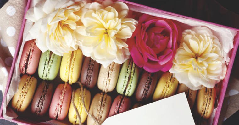 Box of macaroons and flowers