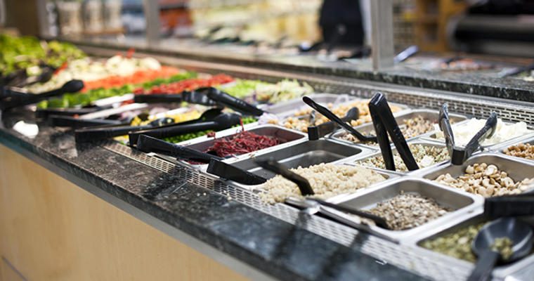 food safety sneeze guard covers the salad bar