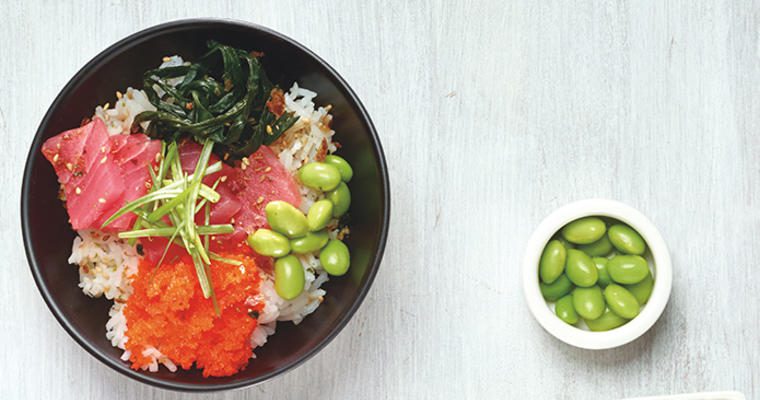 Bowl of Poke with edamame on the side