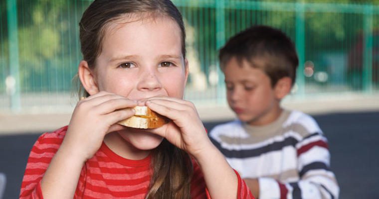 Girl eating sandwich
