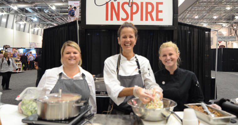 Three chefs preparing food at the Created to Inspire Booth