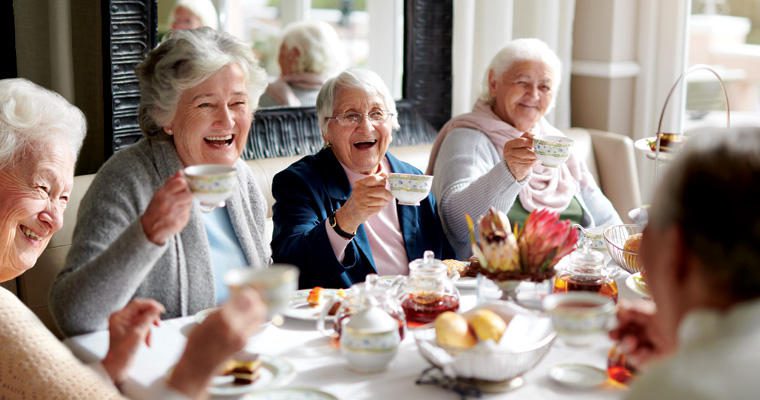 seniors raise a toast at a catered healthcare event