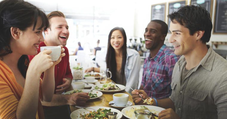 Group of people at a restaurant laughing