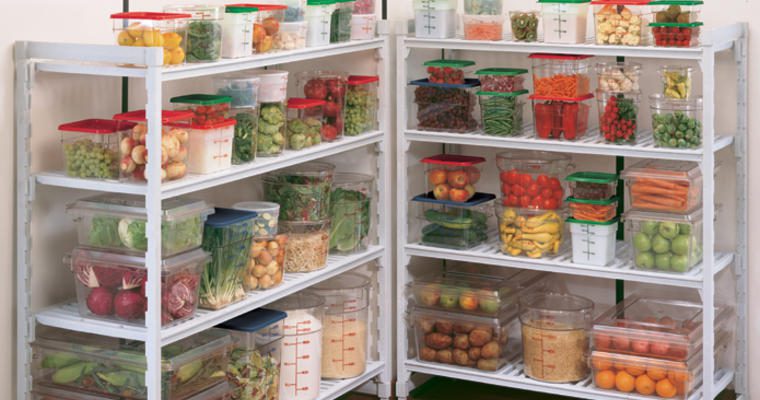 Fruits and vegetables in containers on shelves