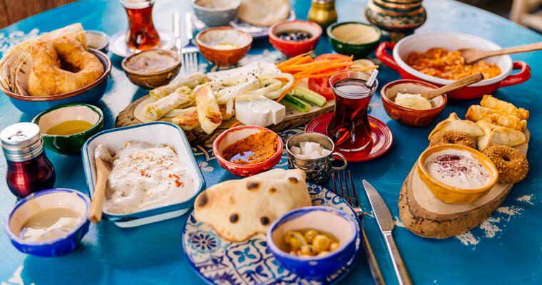 A table filled with diverse Mediterranean foods.