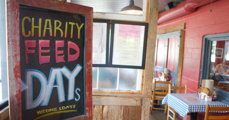 Restaurant sign that reads Charity Feed days Wednesdays