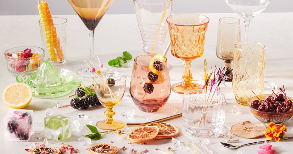 Colorful glasses with fruit garnishes