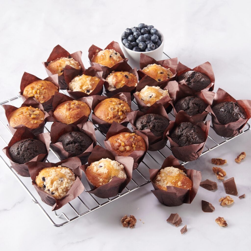 variety of muffins on a baking tray