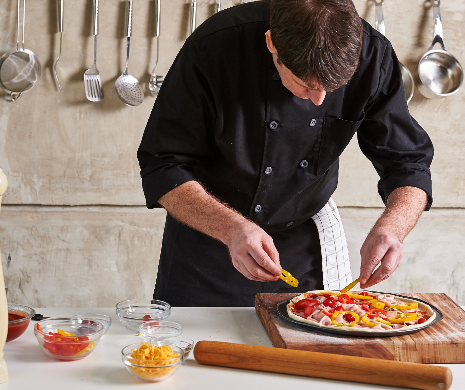 chef preparing dish for meal production