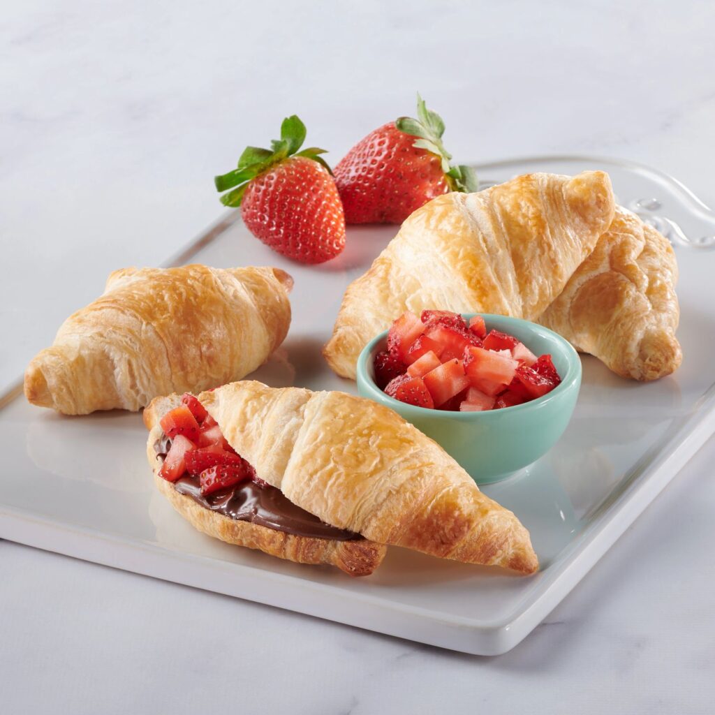 Croissant rolls loaded with nutella and fresh strawberries.